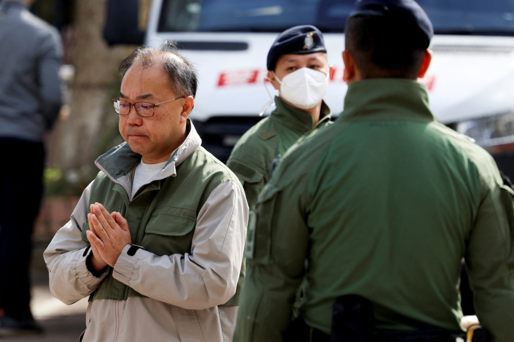 A man gestures outside the Kwong Fuk Community Hall where relatives identify family members from photos, following the deadly Wang Fuk Court housing complex fire, in Tai Po, Hong Kong, China, November 28, 2025. — Reuters pic 