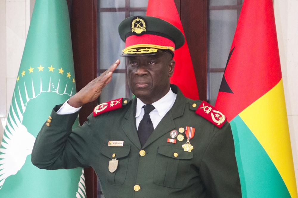 Major-General Horta Inta-a, the new transitional president, salutes during the swearing-in ceremony of Major-General Tomas Djassi as the new chief of staff of the Armed Forces in Bissau, Guinea-Bissau, on November 27, 2025. — Reuters pic