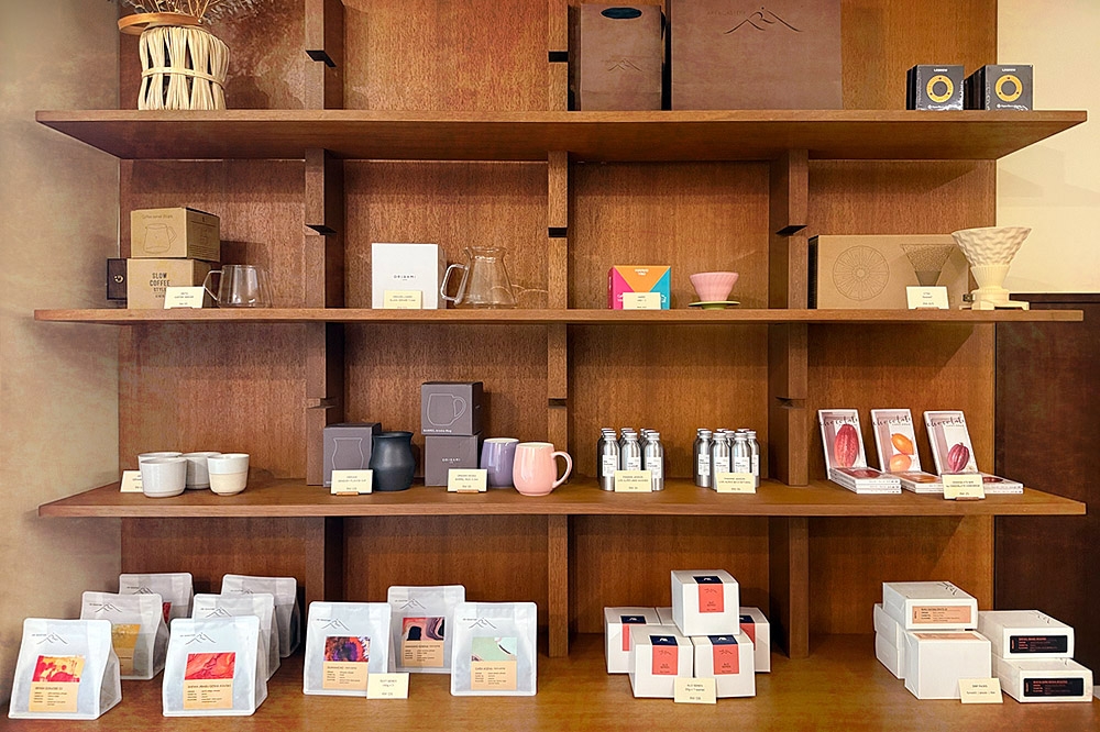 The feature display: bags of coffee beans, coffee drippers and cups. — Picture by CK Lim