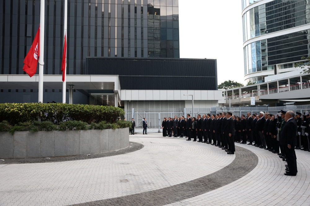 Hong Kong holds moment of silence as nation mourns victims of tower blaze