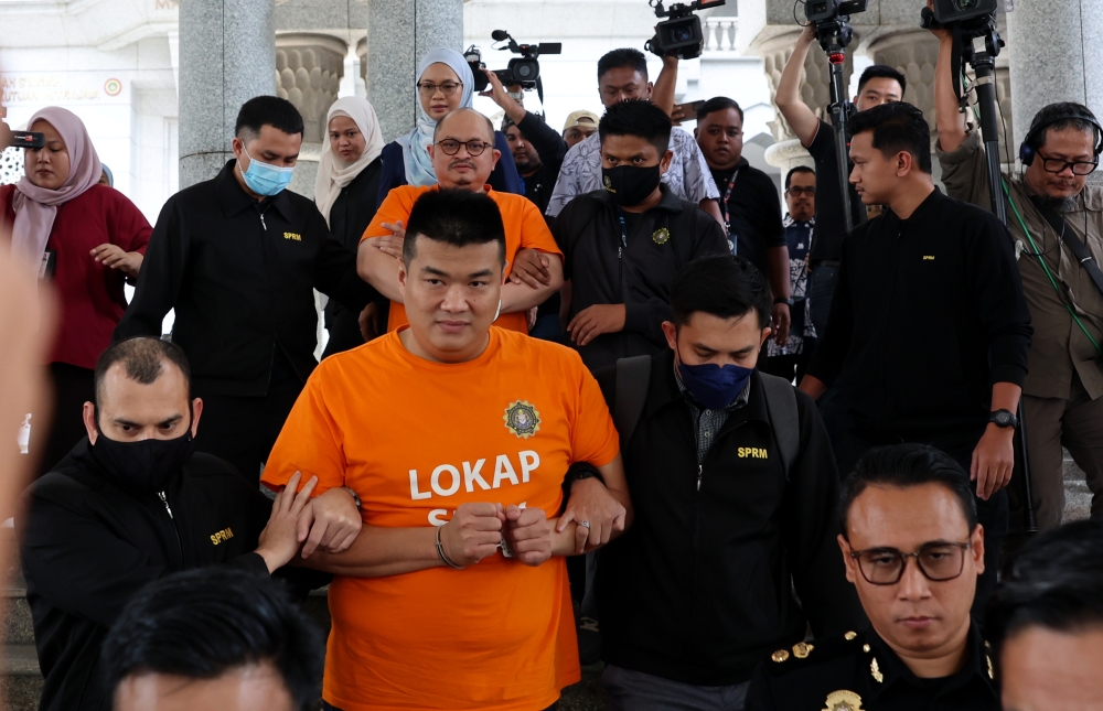 Former Senior Political Secretary to the Prime Minister Datuk Seri Shamsul Iskandar Mohd Akin and businessman Albert Tei Jiann Cheing are remanded until December 4 in Putrajaya on November 29, 2025. — Bernama pic