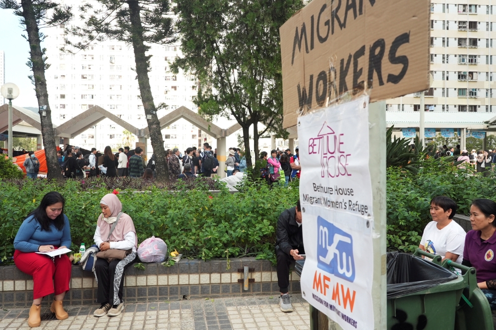A volunteer gathers information from Fita (second from left), a 49-year-old Indonesian domestic worker who escaped the deadly fire at Wang Fuk Court housing complex in Tai Po, Hong Kong, China November 28, 2025. — Reuters pic