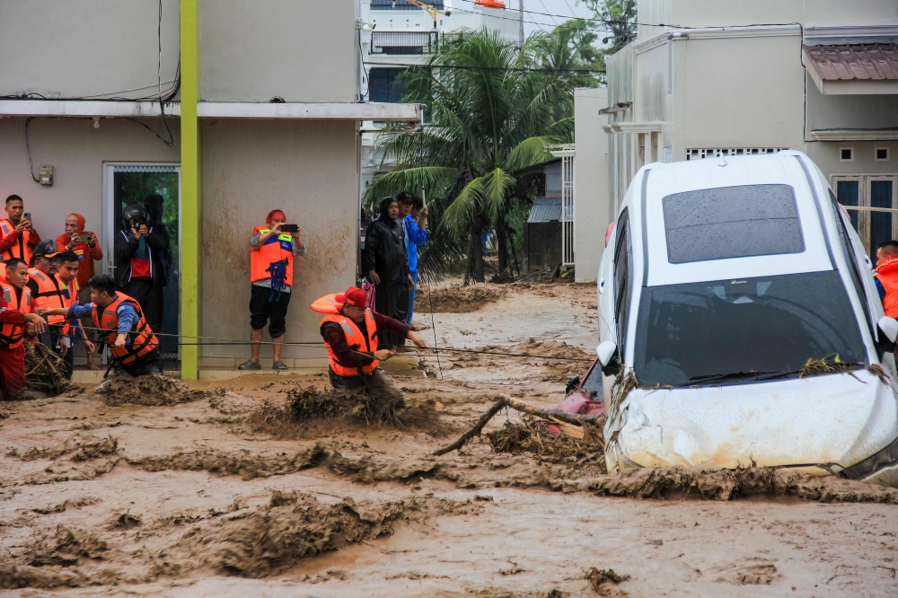 Clean-up begins in Thailand and Indonesia after catastrophic floods claim hundreds of lives