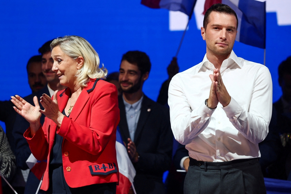Jordan Bardella (right) president of the French far-right National Rally (Rassemblement National - RN) party and member of the European Parliament is seen with Marine Le Pen, (left) French member of parliament and parliamentary leader of the far-right National Rally (Rassemblement National - RN) party. — Reuters pic 