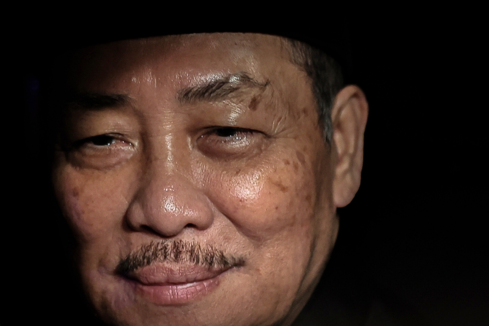 Chief Minister Datuk Seri Hajiji Noor smiles from his vehicle after being sworn in for a second term at Istana Seri Kinabalu, Kota Kinabalu today. — Bernama pic