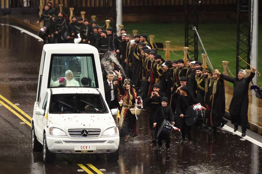 A handout photograph released by the Lebanese Presidency’s press office shows Pope Leo XIV arriving in the popemobile at the presidential palace in Baabda, east of the capital Beirut, for a meeting with the Lebanese president on November 30, 2025. — Lebanese Presidency handout pic via AFP
