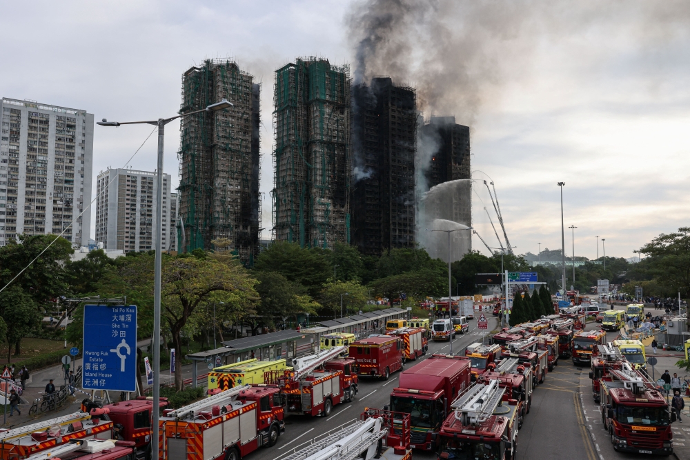 A view of the damaged towers of Wang Fuk Court housing estate, where a major fire engulfed bamboo scaffolding across multiple blocks, killing at least 44 people and leaving almost 300 missing, in Tai Po, Hong Kong November 27, 2025. — Reuters pic