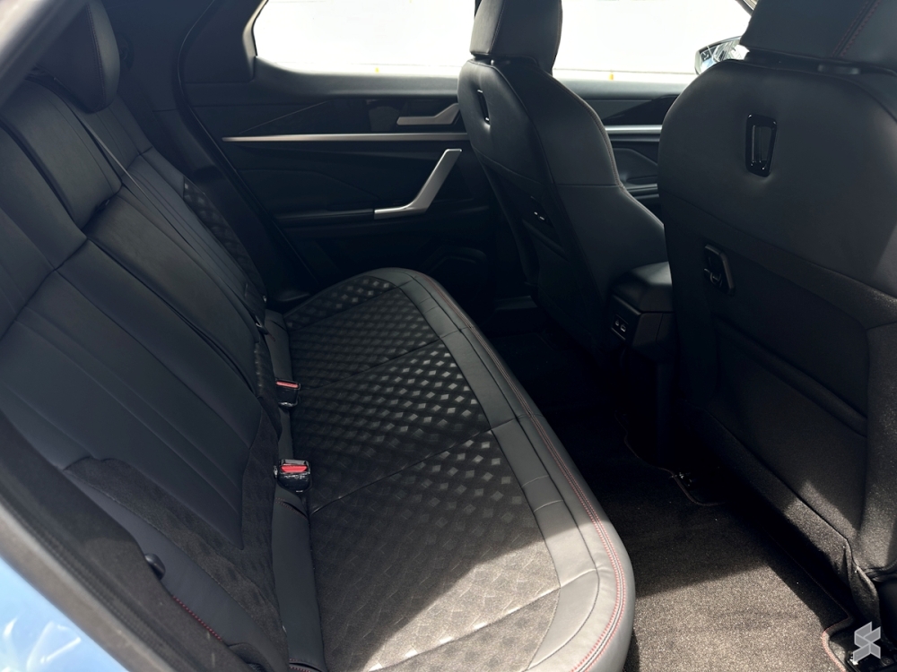 The seats are a mix of leatherette and fabric, and the car includes a leather-wrapped, flat-bottomed, two-spoke steering wheel. — SoyaCincau pic