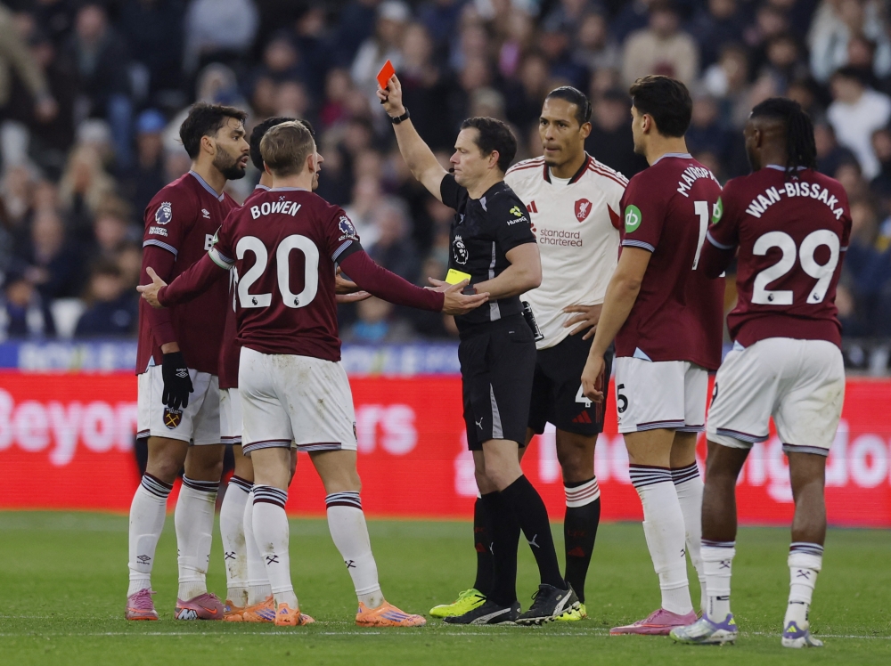 West Ham United’s Lucas Paqueta is shown a red card by referee Darren England during a match against Liverpool at London Stadium, London, November 30, 2025. — Action Images pic via Reuters