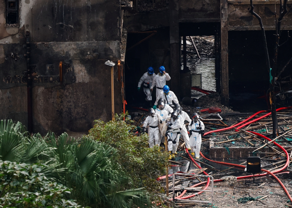 Hong Kong police comb fire-ravaged towers, 11 arrested as death toll hits 146