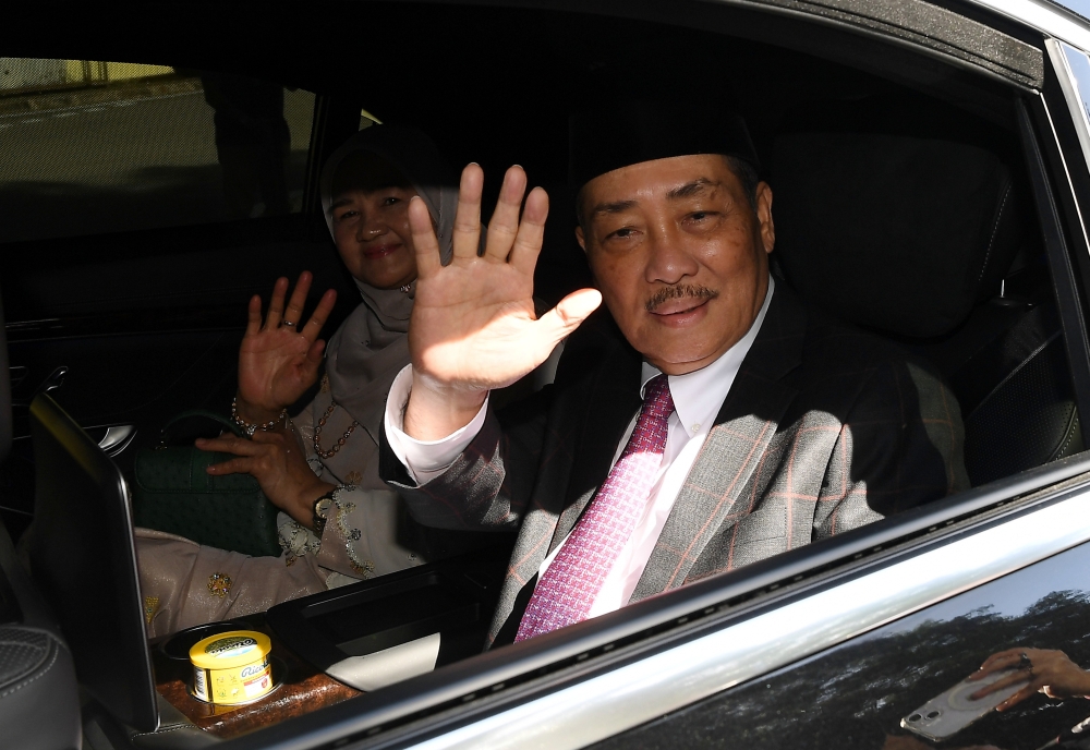 Sabah Chief Minister Datuk Seri Hajiji Noor waves to members of the media as his vehicle enters Istana Seri Kinabalu in Kota Kinabalu December 1, 2025. — Bernama pic