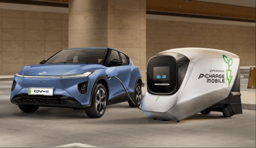 Weighing almost two-tonnes, this 'bulky' power bank features a customisable digital “eyes” on its dark glass front panel, which doubles as a stylised 'face'. — Picture courtesy of Perodua