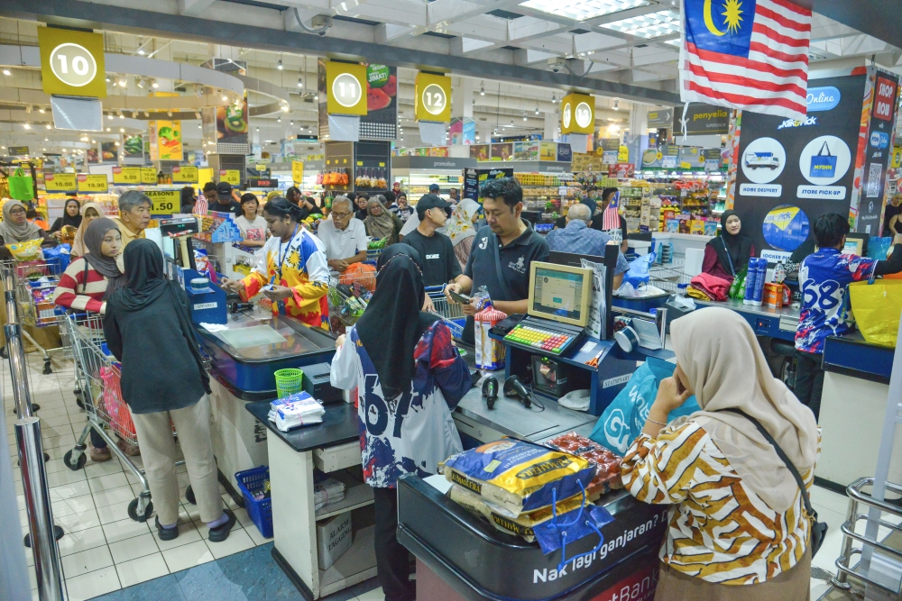 People shop for basic necessities at a supermarket in Subang Jaya on August 31, 2025. — Bernama pic