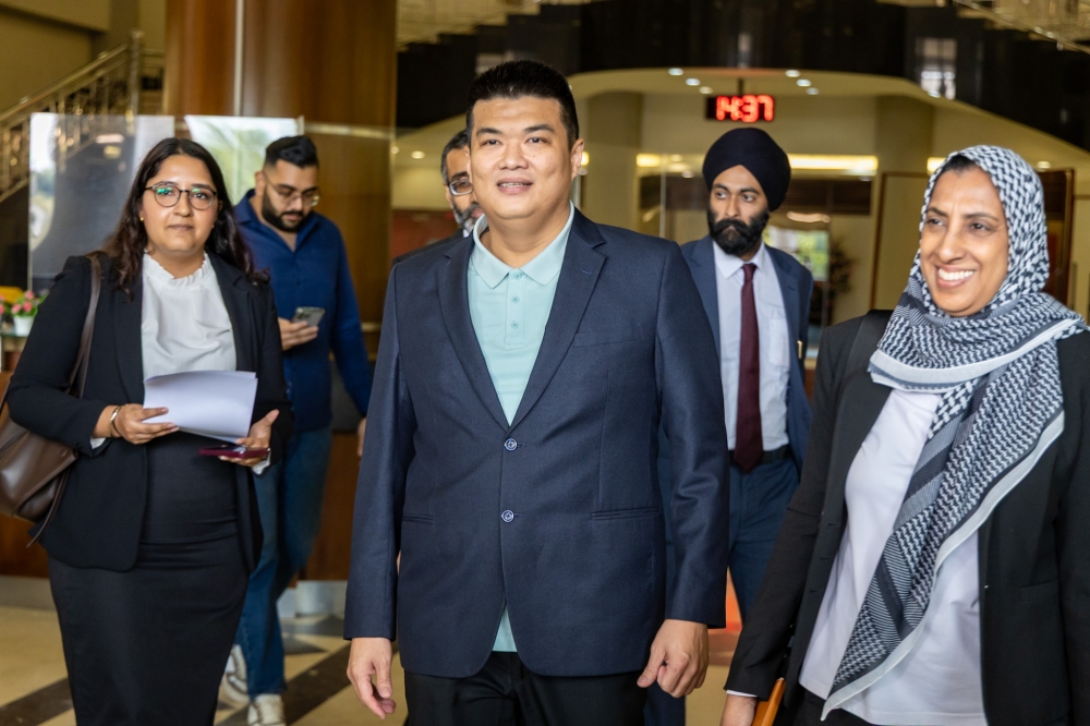 Businessman Albert Tei is pictured alongside his lawyer Latheefa Koya (right) at the Kuala Lumpur Court Complex in Kuala Lumpur December 4, 2025. — Picture by Firdaus Latif