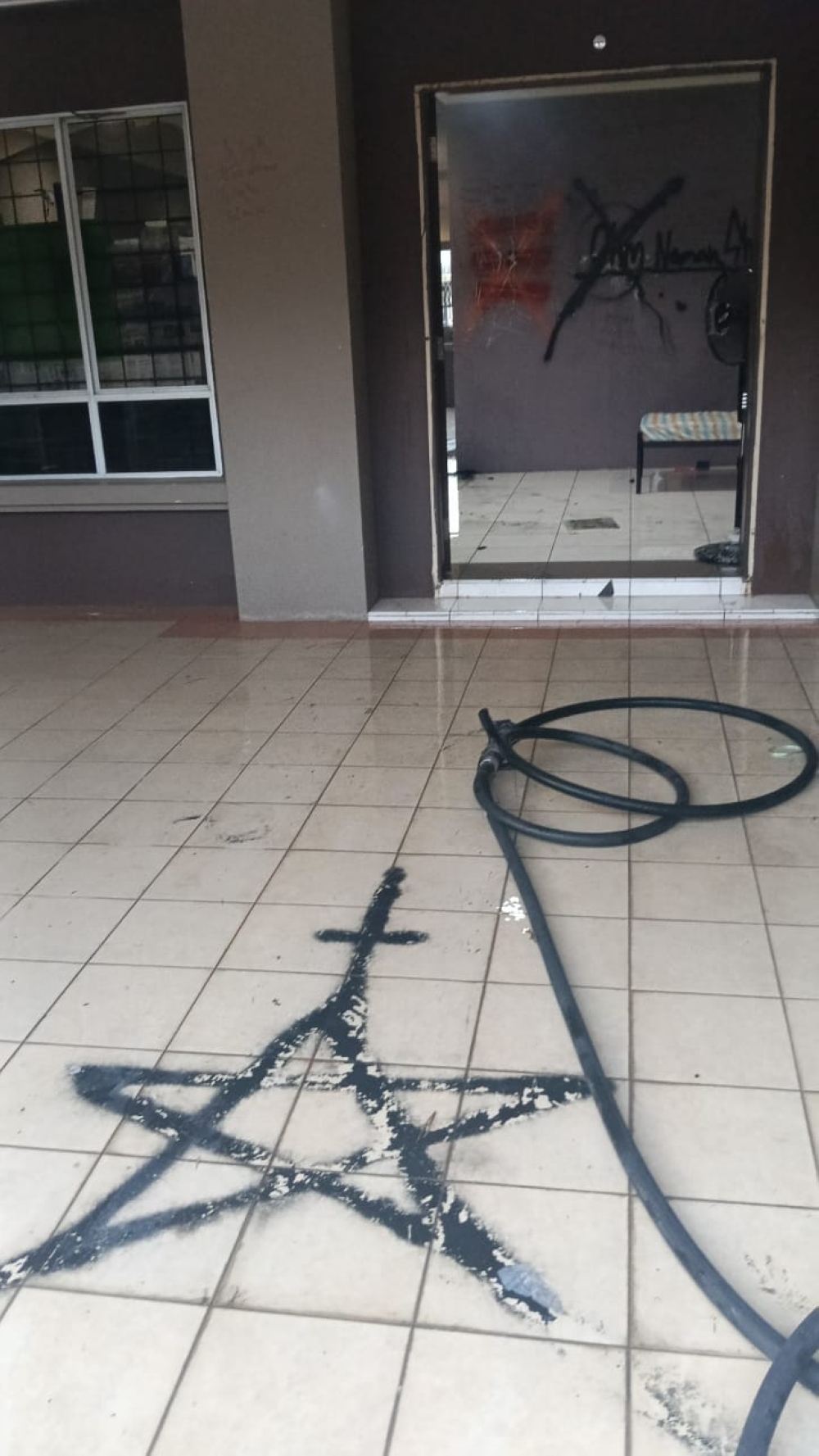 One of the pentagrams drawn on the house’s floor. — Bomba pic