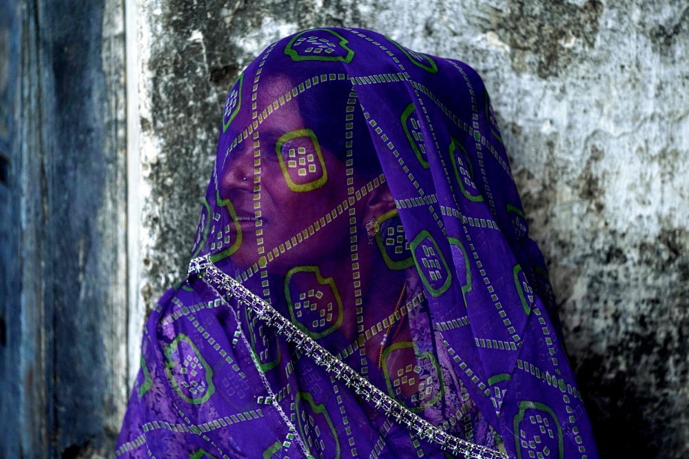This photograph taken on October 8, 2025 shows a woman wearing a veil at a village in Rajasthan's Beawar district. — AFP pic