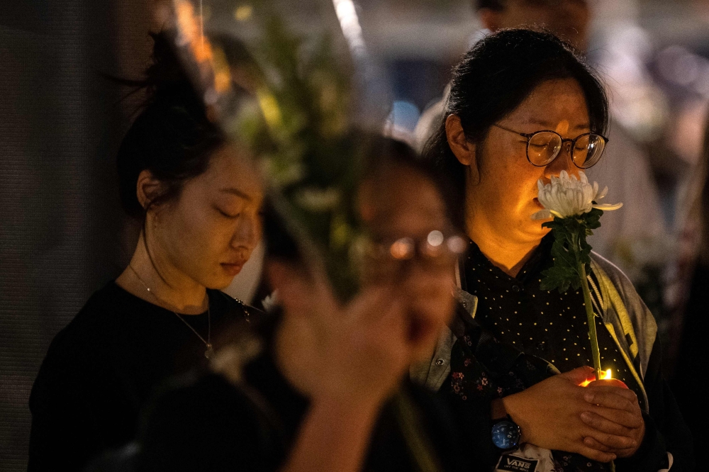 Hong Kong student union suspended after note demanding justice for fire victims