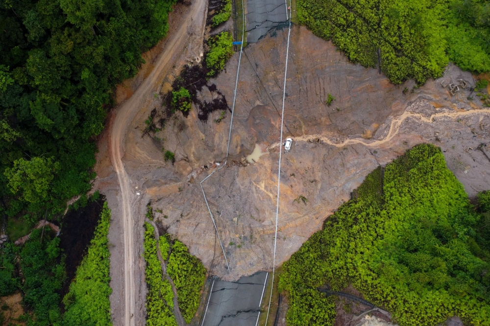 The SUV carrying an engaged couple that plunged 60 metres into a ravine at Km 52 of Jalan Kuala Jeneris–Sungai Gawi–Aring (Bukit Kawah) near Tasik Kenyir yesterday is seen during a site visit in Kuala Berang December 6, 2025. — Bernama pic