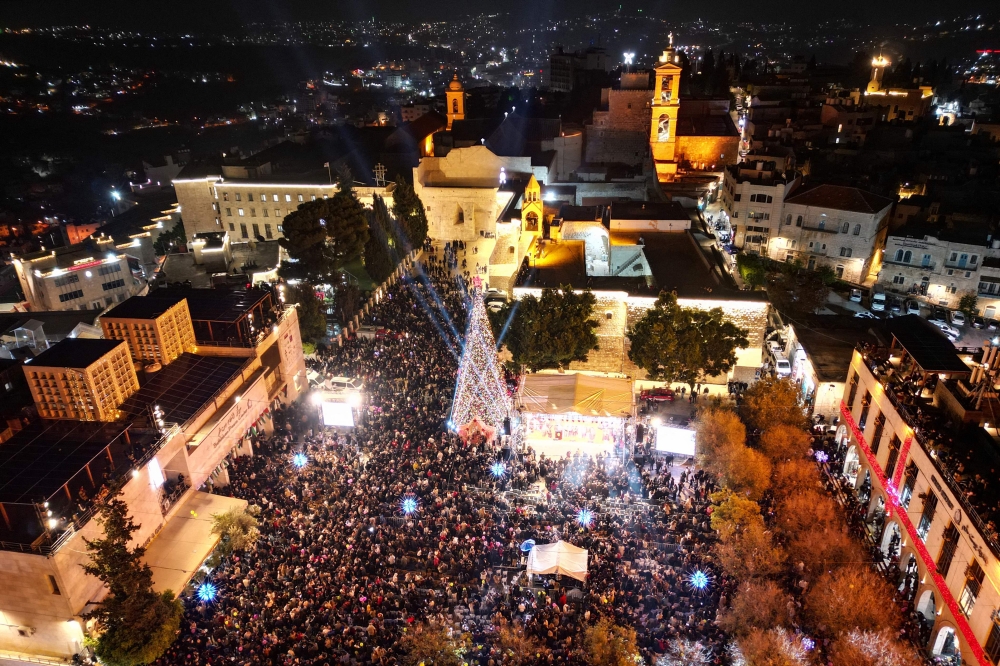 Christmas returns to Bethlehem as tree lights up for first time since Gaza war began