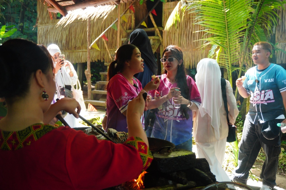 Visitors at the Mari Mari Cultural Village in Inanam learn about Sabah’s diverse ethnicities and their heritage. — Picture from Facebook/Mari Mari Cultural Village 