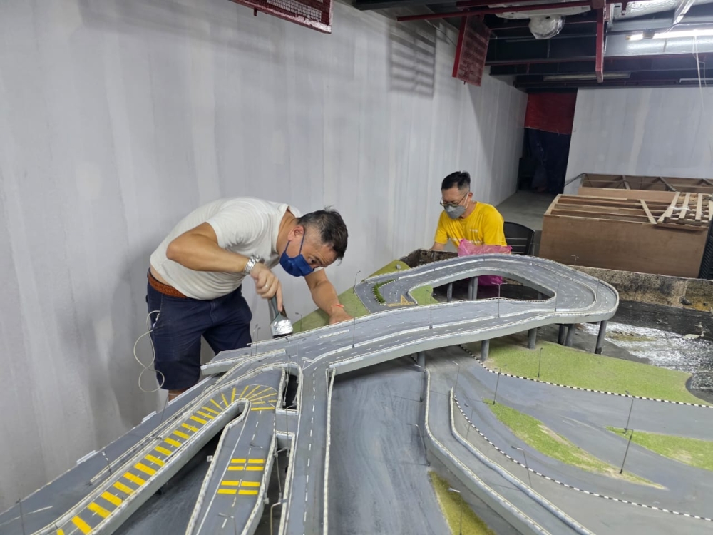 The making of the Weld Quay diorama inside the Penang Ferry Museum. — Picture courtesy of Choo Huang Ming
