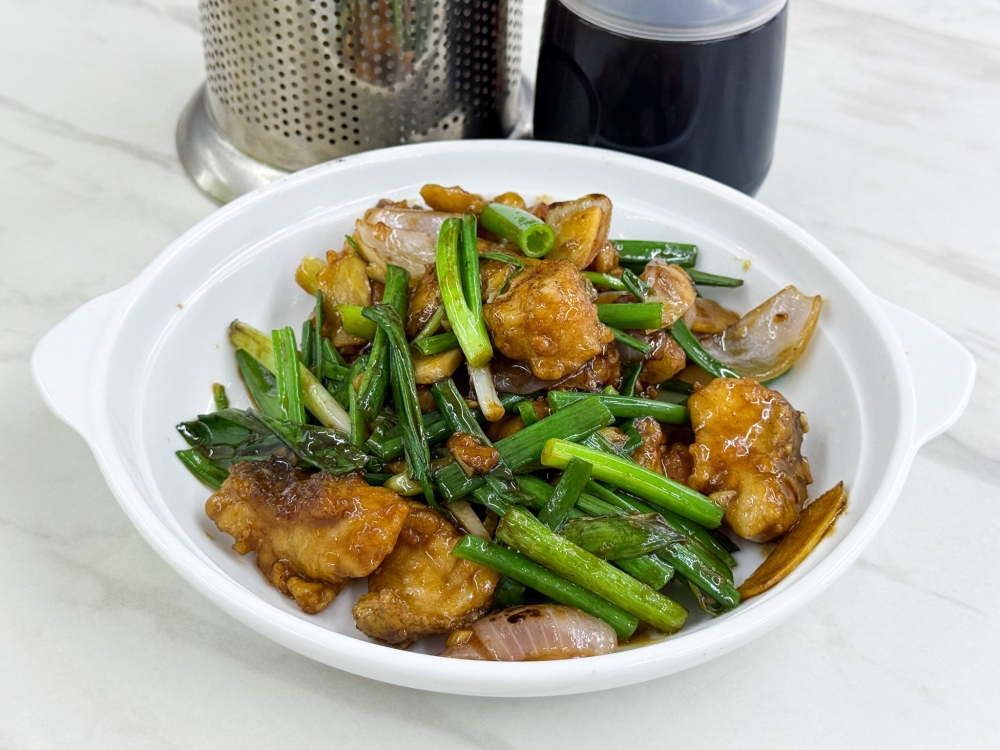 Ginger Fried Sea Grouper Meat has chunky pieces of fish paired with ginger and spring onions . — Picture by Lee Khang Yi