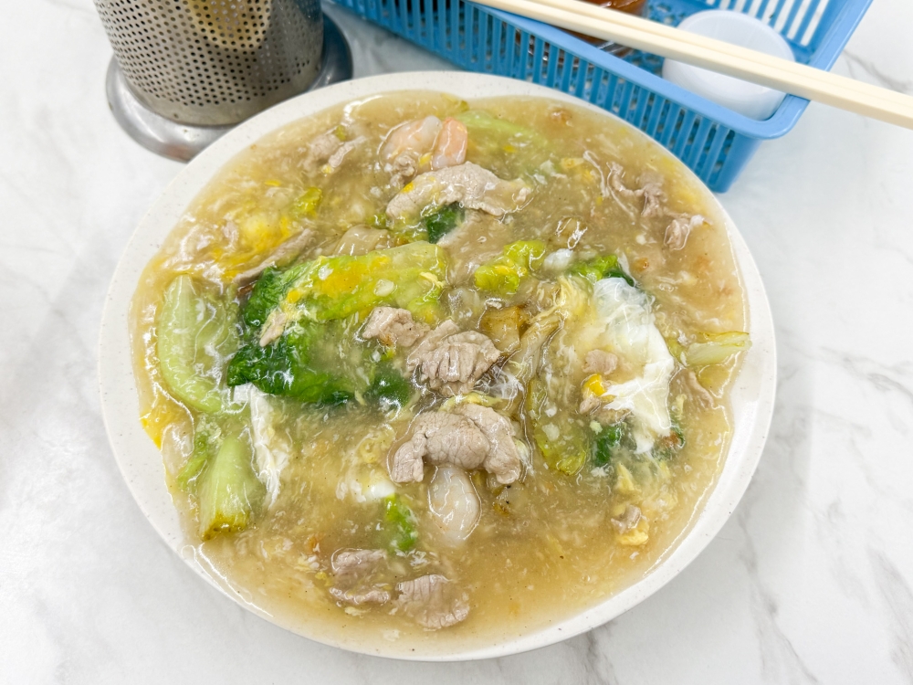 Cantonese Style Noodles may look ordinary but underneath the eggy sauce, discover ‘wok hei’ fried ‘kuey teow’ and crispy ‘meehoon’ to relish . — Picture by Lee Khang Yi