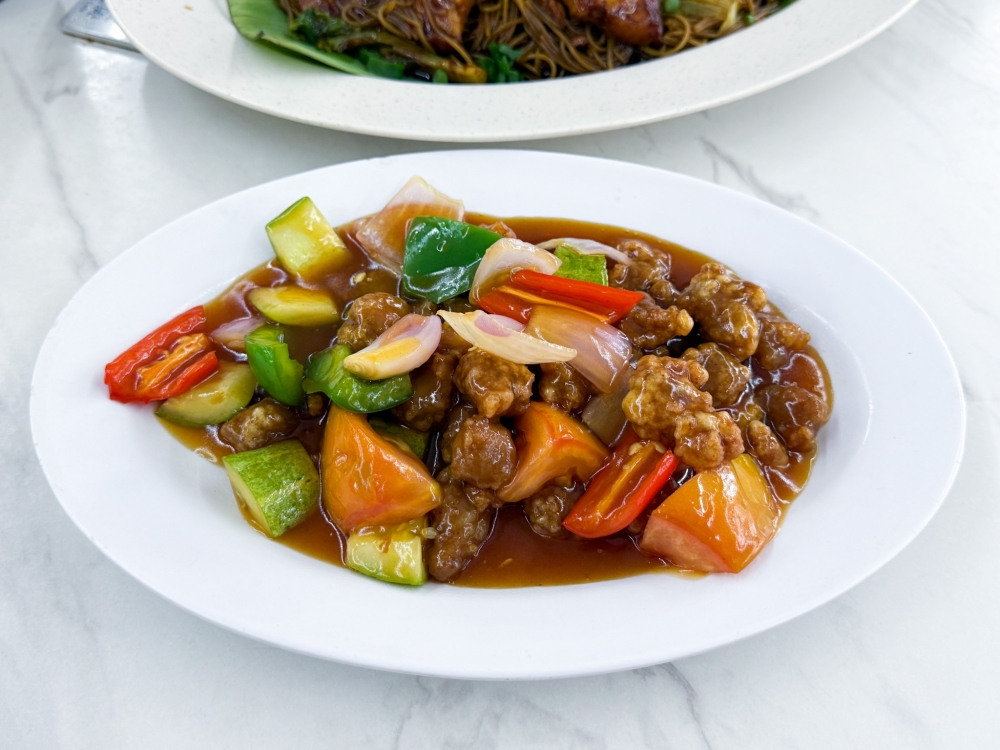 Sweet and Sour Pork can be added to your meal . — Picture by Lee Khang Yi