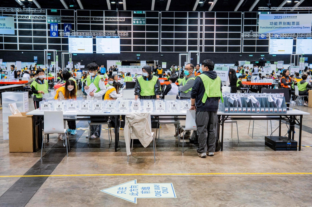 Election officials began counting the ballots after polls closed in the Legislative Council elections in Hong Kong today. — AFP pic