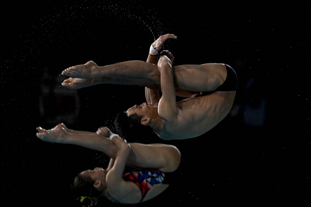 Malaysia’s Nur Dhabitah Sabri and Muhammad Syafiq Puteh compete during the mixed synchronised 3m springboard diving final on day eleven of the Commonwealth Games at Sandwell Aquatics Centre in Birmingham August 8, 2022. Nur Dhabitah Sabri will be absent, leaving Muhammad Syafiq to guide a lineup of newcomers. — AFP pic