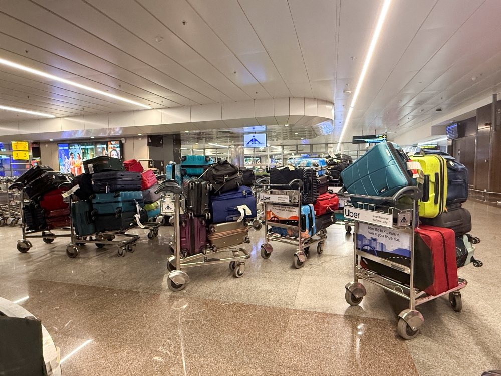 Luggage of passengers whose IndiGo flight was cancelled sits on trolleys at an airport in Pune, India December 4, 2025. — Reuters pic