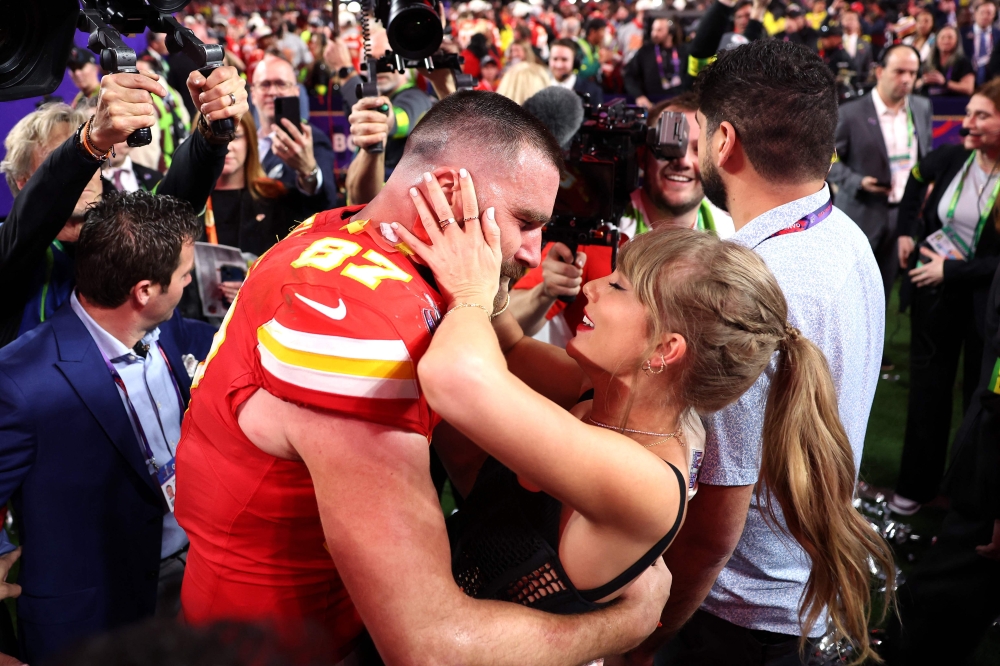 A file photo shows Travis Kelce of the Kansas City Chiefs kissing Taylor Swift after the Super Bowl LVIII at Allegiant Stadium in Las Vegas on February 11, 2024. — AFP pic