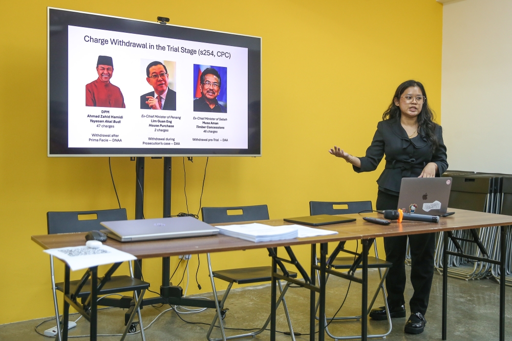 Projek Sama’s legal researcher, Farah Izzah Haron speaks about the different corruption cases examined in the Projek SAMA report she wrote in Petaling Jaya on December 9, 2025. — Picture by Yusof Mat Isa