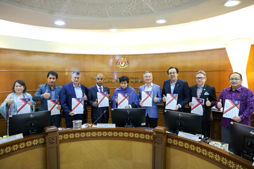 Minister in the Prime Minister’s Department (Law and Institutional Reform) Datuk Seri Azalina Othman Said (centre) said the government has begun the second phase of separating the roles of the Attorney General and Public Prosecutor, which will involve studying required constitutional and legal amendments. — Picture via Facebook/Azalina Othman Said