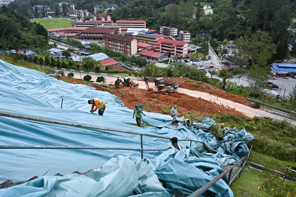 Slope-protection measures being carried out adjacent to the Puncak Arabella Apartments in Tanah Rata, Cameron Highlands ahead of large-scale cleaning works following a landslide on November 28, 2025. — Bernama pic