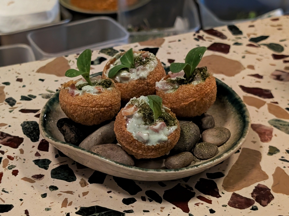 ‘Pani puri’ filled with house-made green yoghurt, tomato relish and seared white prawns. — Picture by Ethan Lau