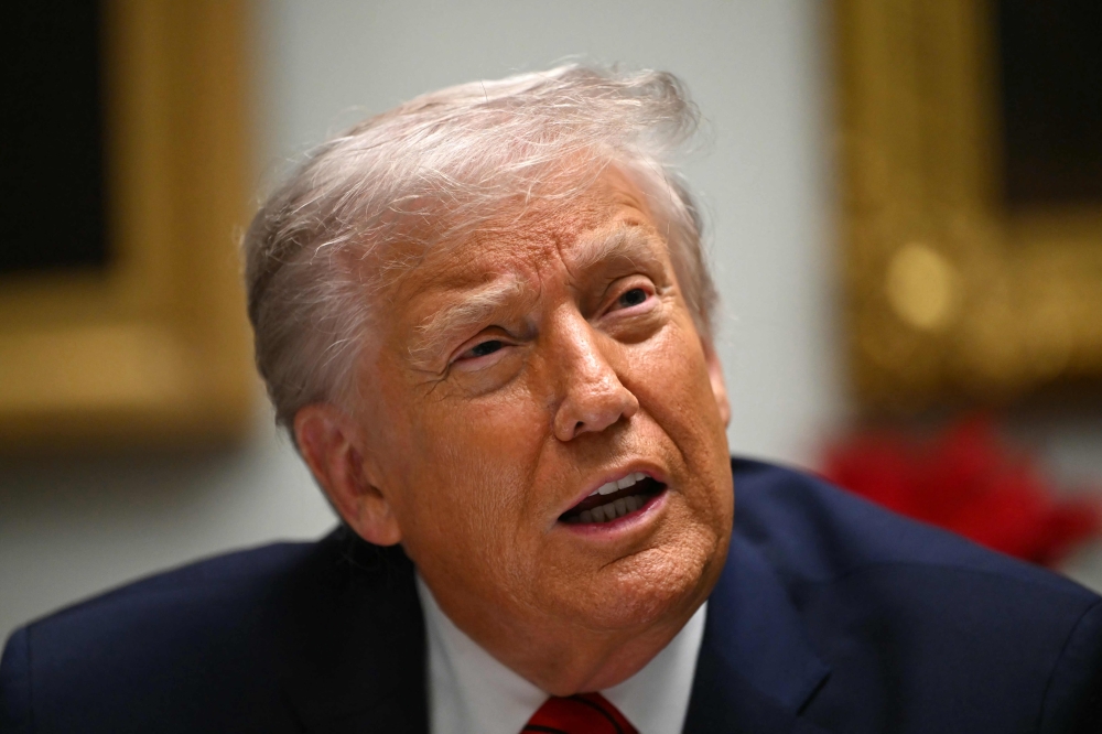 US President Donald Trump speaks during a roundtable discussion in the Roosevelt Room of the White House in Washington, DC December 10, 2025. Many observers believe Trump has politically forced himself to take some sort of action, as weeks have gone by since he threatened strikes. — AFP pic