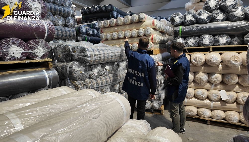 Italian Guardia di Finanza (Tax Police) carry out a search at a textile firm during an investigation in the Tuscan city of Prato, Italy. — Guardia di Finanza Press Office/Handout via Reuters pic