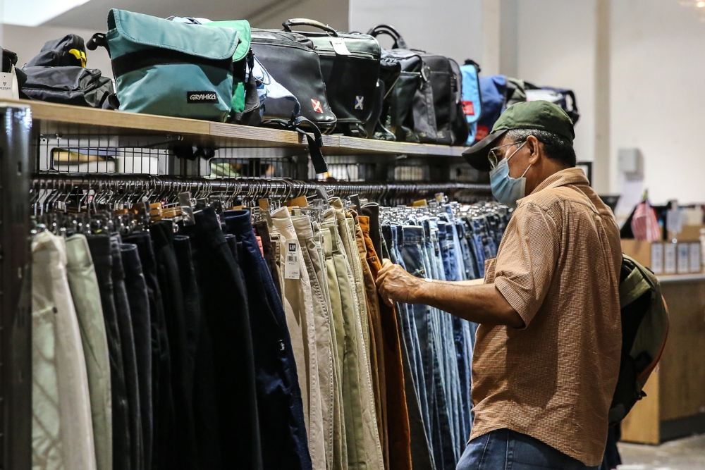 A man browses items at the 2nd Street Bundle Shop in Bandar Utama. — Photo via Yusof Mat Isa