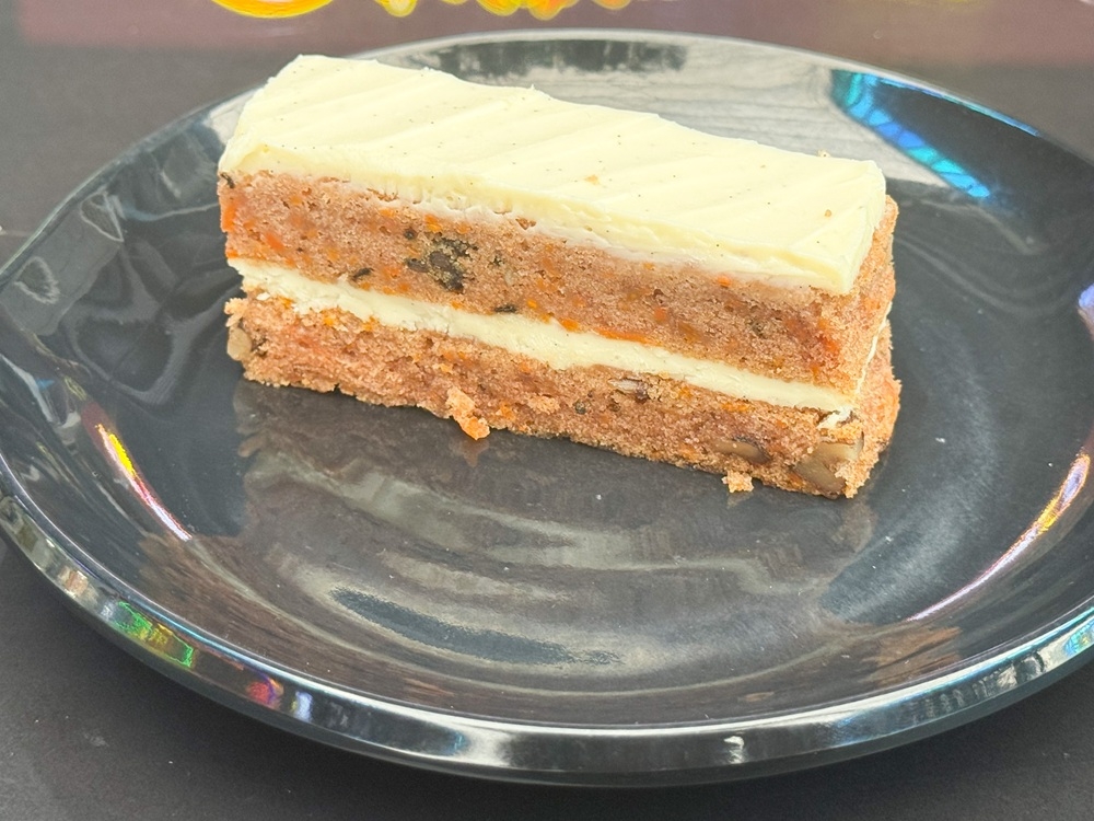 Carrot cake is moist and lighter on cinnamon, making it easy to like with a generous layer of cream cheese frosting. — Picture by Lee Khang Yi