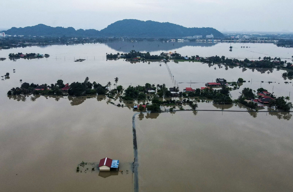 File picture of an aerial view showing homes surrounded by flood waters in Kangar in northern Malaysia’s Perlis state on November 28, 2025, as severe flooding affected thousands of people in the region following days of heavy rain. — AFP pic