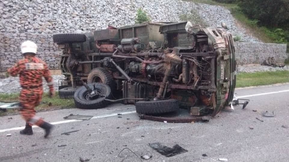 The front-seat passenger of the army truck died at the scene, while the remaining three soldiers and the Proton Wira driver were sent to Machang Hospital for treatment. — Picture via Facebook