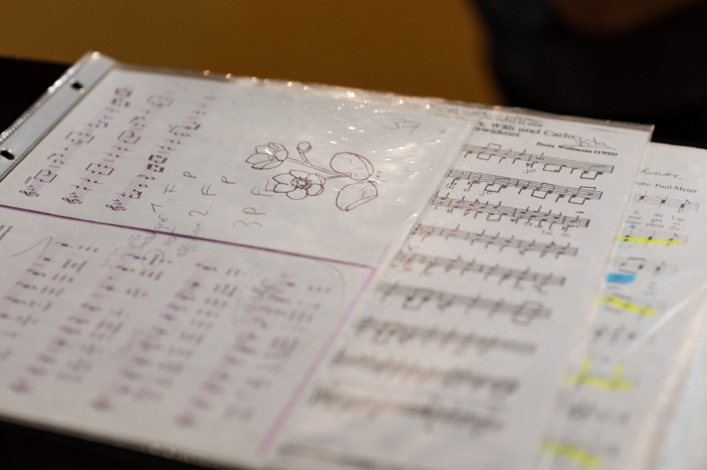 The sheet music of the women-only yodelling choir, 'Coeur des Yodleuses' , is pictured during a rehearsal as UNESCO is considering adding yodelling to its cultural heritage list, in Geneva December 10, 2025. — Reuters pic