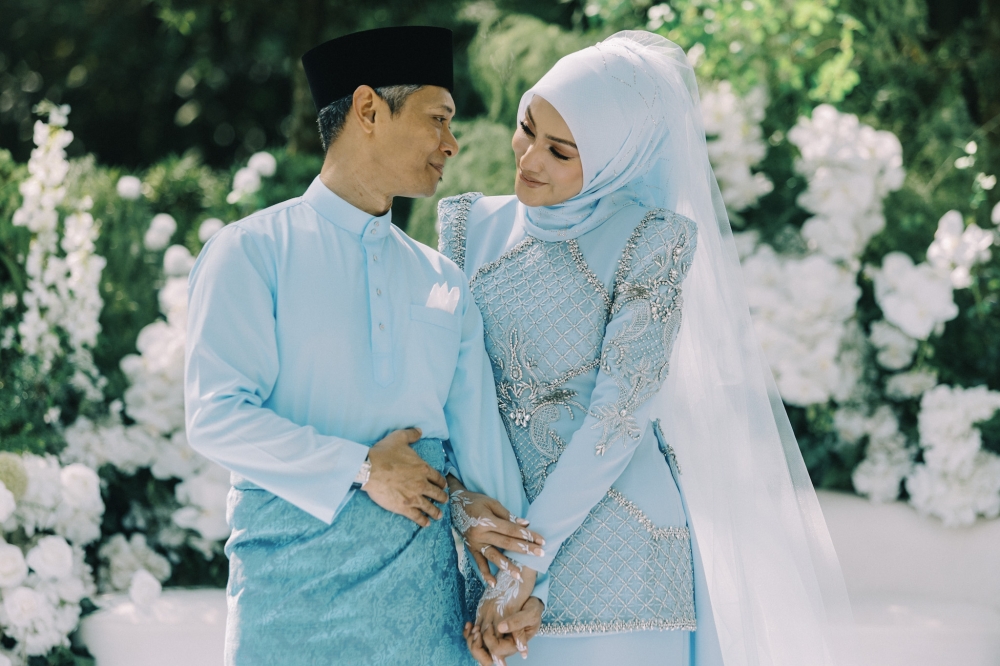 At their wedding, Mr E dismisses ‘trophy wife’ label, describes Erra Fazira as an established career woman