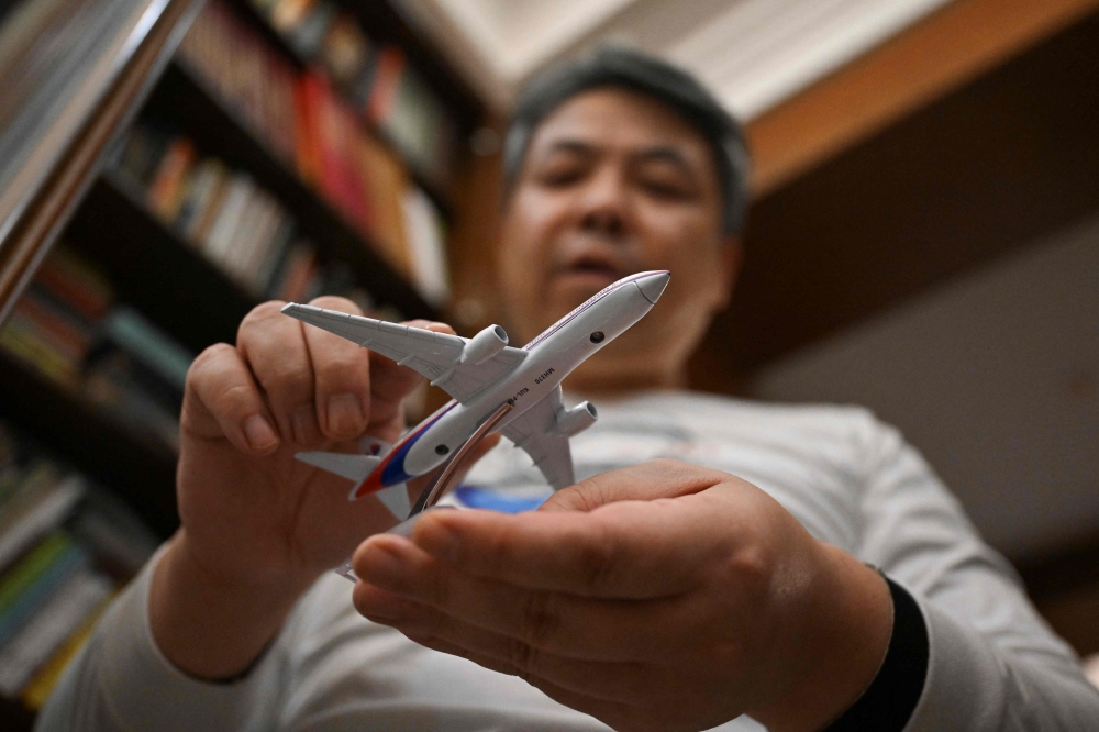 Jiang Hui, 52, has spent more than a decade seeking answers alongside the relatives of other Chinese victims. — AFP pic