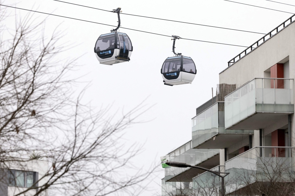 This photograph shows the first urban cable car 'C1' in Ile-de-France region during its official launch, in between Creteil Pointe du Lac and Villeneuve-Saint-Georges, on the outskirst of Paris on December 13, 2025. — AFP pic