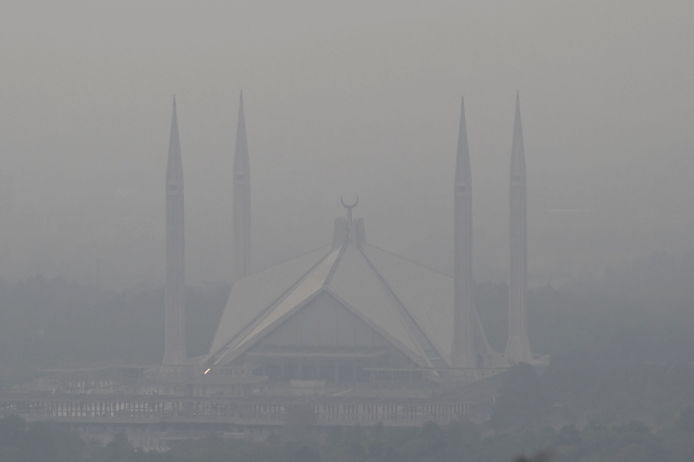 The Shah Faisal Mosque is seen engulfed in dense smog due to severe air pollution in Islamabad, Pakistan on December 9, 2025. — AFP pic