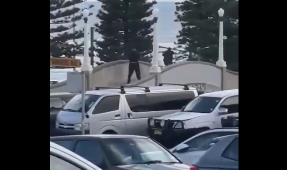 A screengrab from a video on X that reportedly shows two men firing shots.