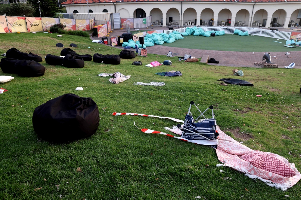 Belongings of members of the Jewish community are seen at the scene of a shooting at Bondi Beach in Sydney on December 15, 2025 that Australian police said was carried out by a father-and-son that left 16 people dead. — AFP pic