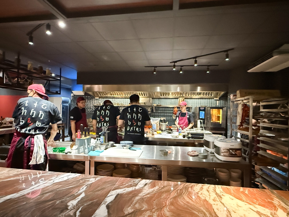 Watch the kitchen action from the Chef's Table. — Picture by Lee Khang Yi